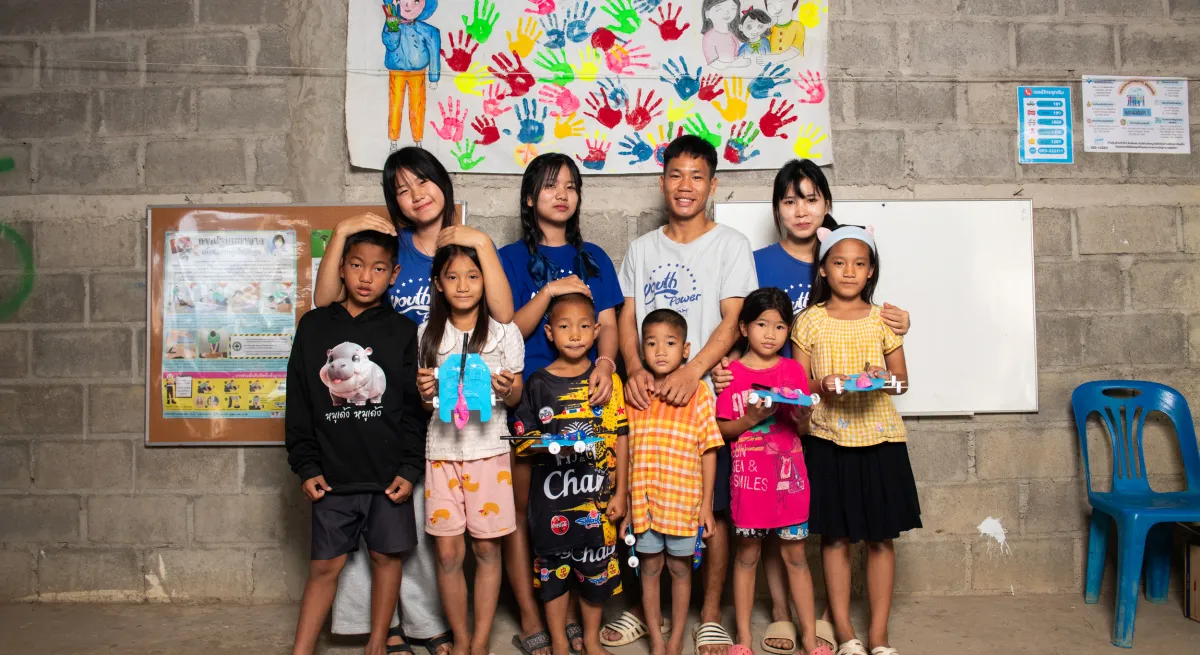 Kids standing in front of a painting