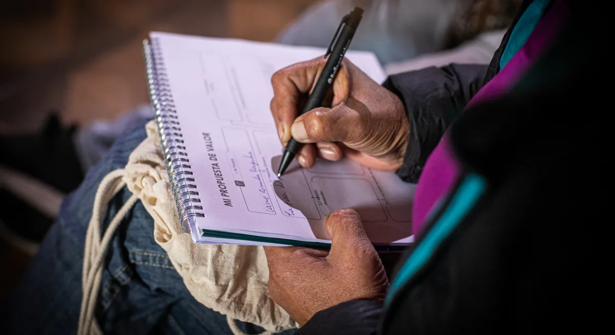 Someone writing on a paper