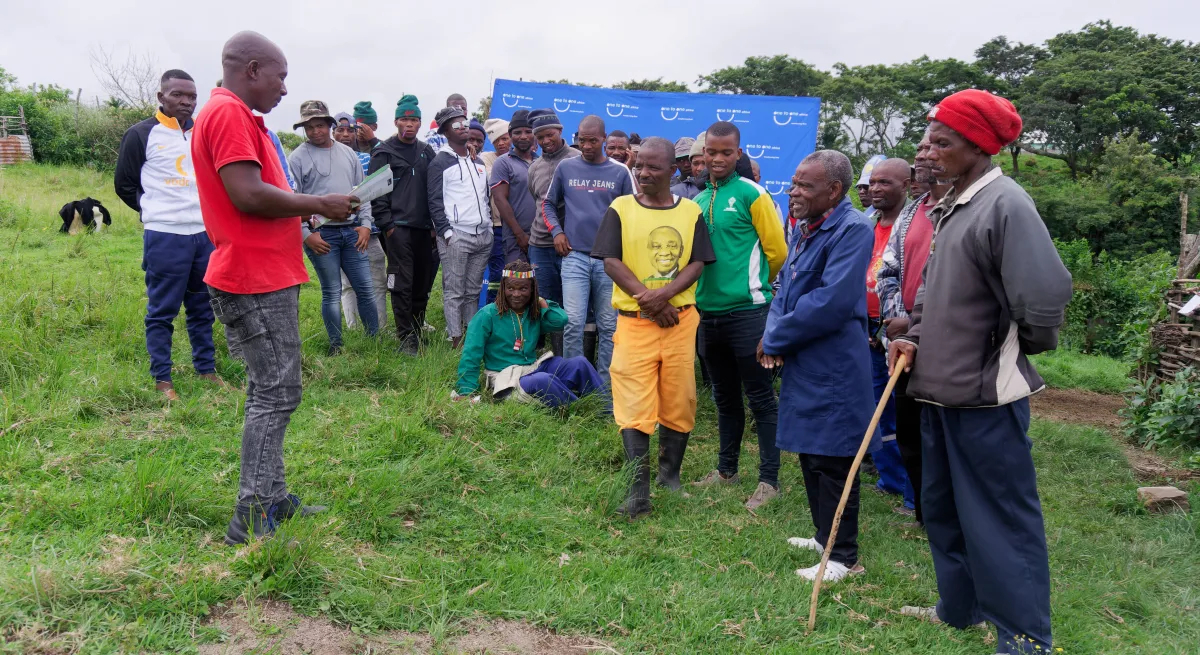 Man talking in front of a group