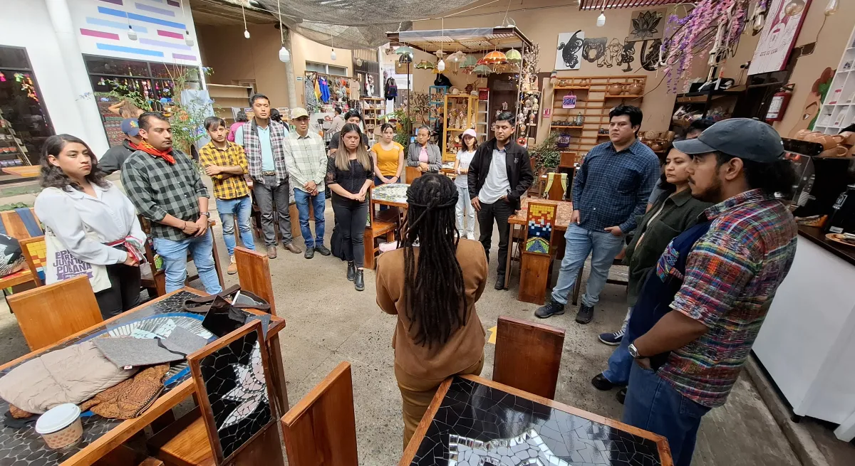 people standing in a workshop