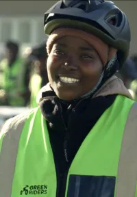 Woman in work clothes smiling